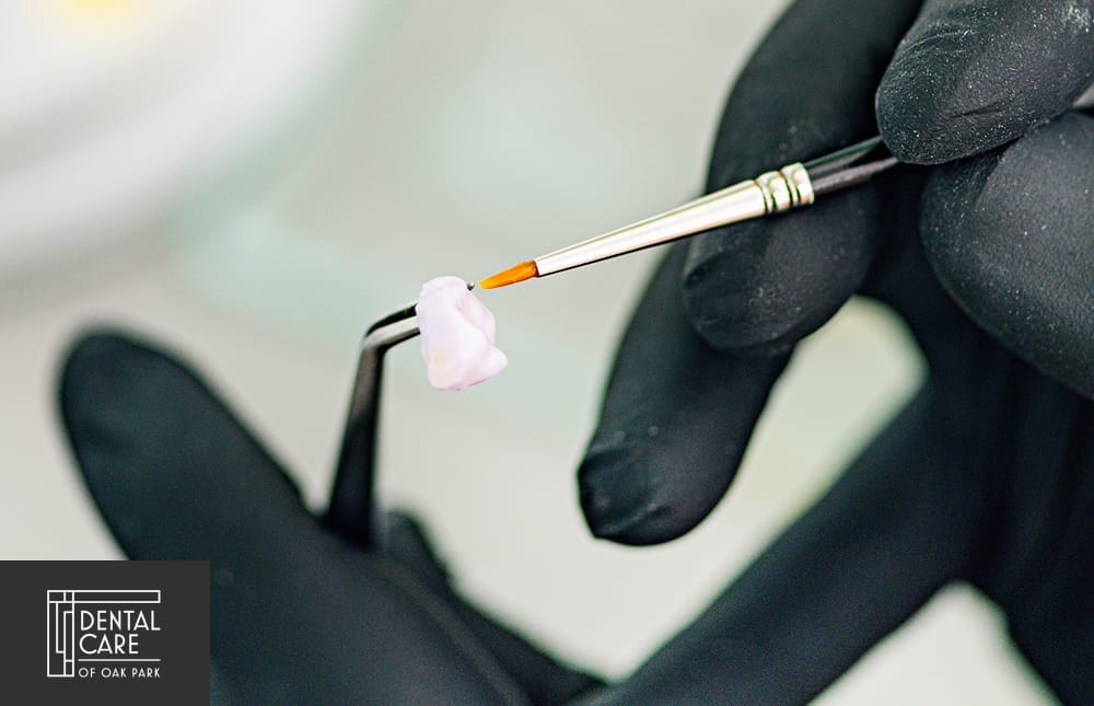 Dental Technician Preparing Ceramic Tooth Crown. Prosthetic Dentistry.
